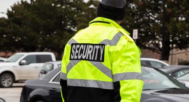 Rear view of parking security watching over the parking area