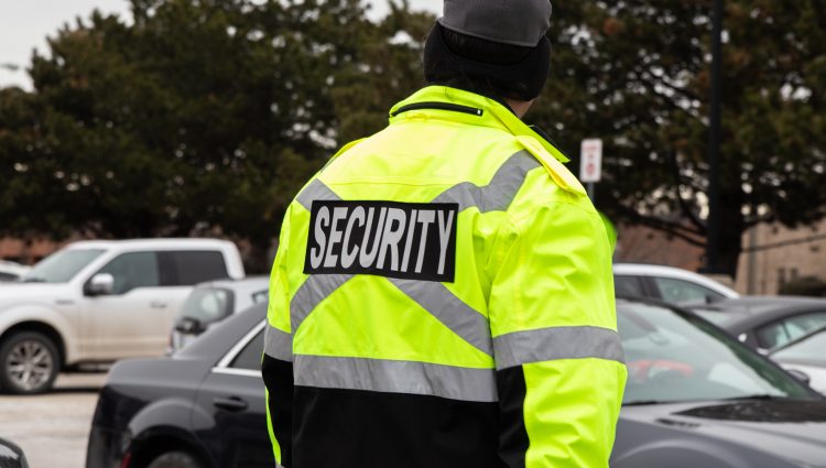 Rear view of parking security watching over the parking area
